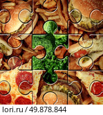 Breaking bad eating habits and choosing the healthy food for a healthier lifestyle as a junk food jigsaw puzzle with one piece replaced with green vegetables as a symbol for changing your diet. Стоковое фото, агентство Ingram Publishing / Фотобанк Лори
