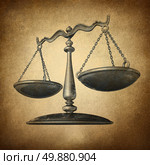 Justice scale with grunge texture as a symbol of law on a vintage parchment texture as a concept for the old legal system in government and society and enforcing historic rights and regulations. Стоковое фото, агентство Ingram Publishing / Фотобанк Лори