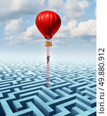 Escape opportunity  and freedom from adversity solution leadership with a businessman climbing a ladder out of a complicated maze in a hot air balloon as a business concept of overcoming challenges for financial success. Стоковое фото, агентство Ingram Publishing / Фотобанк Лори