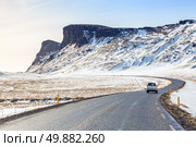 Winter Mountain range road in a sunny day at Vik, Southern of Iceland. Стоковое фото, агентство Ingram Publishing / Фотобанк Лори