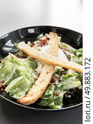 bowl of green caesar salad . Стоковое фото, агентство Ingram Publishing / Фотобанк Лори