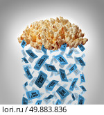 Movie popcorn concept as a group of popped corn shaped as a rain cloud raining theater or cinema tickets as a symbol for mobile media entertainment from the internet for buying admission or watching streaming shows from a virtual server. Стоковое фото, агентство Ingram Publishing / Фотобанк Лори