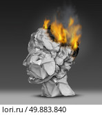Headache  and mental illness concept as a group of crumpled office paper shaped as a human head that is on fire burning away at the brain as a symbol and medical metaphor for emotional stress at work or degenerative dementia disease as alzheimers. Стоковое фото, агентство Ingram Publishing / Фотобанк Лори