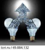 Creative innovation success as two open glass light bulbs releasing gears and cogs coming together in the shape of an upward arrow as a symbol of brainstorming new ideas and technology development. Стоковое фото, агентство Ingram Publishing / Фотобанк Лори