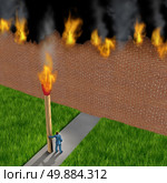 Escape concept as a businessman holding a giant ignited match burning down a brick wall made of paper as a success metaphor for avoiding fear and to destroy obstacles using clever strategy. Стоковое фото, агентство Ingram Publishing / Фотобанк Лори
