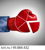 Competition market share loss business concept as a red boxing glove shaped as a financial pie chart diagram as a symbol for losing economic competitiveness. Стоковое фото, агентство Ingram Publishing / Фотобанк Лори