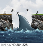 Profit from risk business concept as a group of businesspeople taking advantage of challenging market conditions as a businessman and businesswoman jumping on a shark fin as a bridge to success and opportunity metaphor. Стоковое фото, агентство Ingram Publishing / Фотобанк Лори