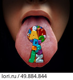 Language solution education concept as a mouth with a tongue sticking out with a group of alphabet letters shaped as a key hole as a metaphor for speech therapy and reading and writing learning solutions. Стоковое фото, агентство Ingram Publishing / Фотобанк Лори