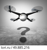 Drone question and unmanned aerial vehicle in flight with a cast shadow shaped as a question mark as a symbol for new surveillance and shipping technology social issues. Стоковое фото, агентство Ingram Publishing / Фотобанк Лори