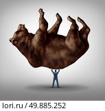 Selling stock and investing pessimism and financial business leadership as a downturn fear concept as a take charge businessman lifting a giant bear as an icon of for conservative bearish market investor. Стоковое фото, агентство Ingram Publishing / Фотобанк Лори
