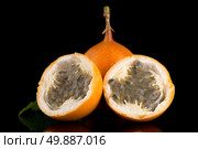Passion fruit maracuja granadilla on black background. Стоковое фото, агентство Ingram Publishing / Фотобанк Лори