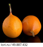 Passion fruit maracuja granadilla on black background. Стоковое фото, агентство Ingram Publishing / Фотобанк Лори