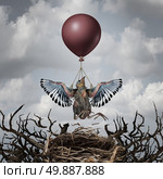 Helping support concept and early assistance metaphor as a baby bird being lifted up to the sky by a balloon as a symbol for providing support and help to the ones in need to achieve a goal and succeed. Стоковое фото, агентство Ingram Publishing / Фотобанк Лори