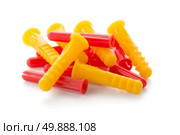 Closeup of colorful plastic dowels isolated on white background. Стоковое фото, агентство Ingram Publishing / Фотобанк Лори