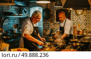 Two men are working together in a kitchen, preparing a meal. They are chopping vegetables, stirring pots, and coordinating their cooking efforts. Стоковое AI-изображение, AI-художник Данила Большаков / Фотобанк Лори