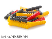 Closeup of colorful plastic dowels isolated on white background. Стоковое фото, агентство Ingram Publishing / Фотобанк Лори
