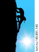Silhouette of climber at the sunset. Element of deisgn. Стоковое фото, агентство Ingram Publishing / Фотобанк Лори