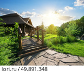 Bridge and house of log in the forest. Стоковое фото, агентство Ingram Publishing / Фотобанк Лори