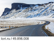 Winter Mountain range road in a sunny day at Vik, Southern of Iceland. Стоковое фото, агентство Ingram Publishing / Фотобанк Лори