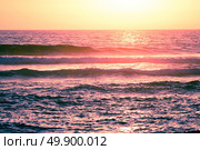 Ocean wave breaking down at sunset time. Стоковое фото, агентство Ingram Publishing / Фотобанк Лори