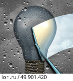 Positive thinking and eliinating negative outlook as a wiper clearing a cloudy wet window with a grey dark light bulb and a wiper cleaning it to expose a clean bright light as a solution and possibility icon as a 3D illustration. Стоковое фото, агентство Ingram Publishing / Фотобанк Лори