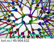 Network center nucleus as a vast diverse group of ropes tied and connected to a centralized circle as a technology and global internet metaphor for being linked together. Стоковое фото, агентство Ingram Publishing / Фотобанк Лори