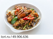 Fresh soft crabs cooked in black pepper sauce on white background. Стоковое фото, агентство Ingram Publishing / Фотобанк Лори