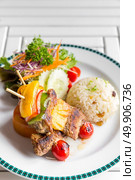 grilled beef skewer with fried rice. Стоковое фото, агентство Ingram Publishing / Фотобанк Лори