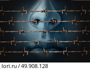 Concept of censorship and freedom of speech crisis symbol and suppression in expression of ideas icon as a human behind in old barbed wire as a metaphor for depression and social isolation in a 3D illustration style. Стоковое фото, агентство Ingram Publishing / Фотобанк Лори