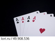 ace four of a kind poker card on dark black background. Стоковое фото, агентство Ingram Publishing / Фотобанк Лори