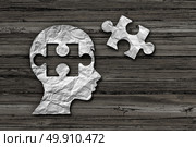 Children learning solution and early education strategy or mental health care and cognition concept as crumpled paper shaped as a child and jigsaw puzzle piece in a 3D illustration style. Стоковое фото, агентство Ingram Publishing / Фотобанк Лори