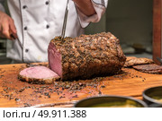 Carving of Wagyu beef roast. Стоковое фото, агентство Ingram Publishing / Фотобанк Лори