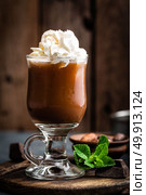 Iced cocoa drink with whipped cream, cold chocolate beverage, coffee frappe on dark background. Стоковое фото, агентство Ingram Publishing / Фотобанк Лори