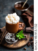 Iced cocoa drink with whipped cream, cold chocolate beverage, coffee frappe on dark background. Стоковое фото, агентство Ingram Publishing / Фотобанк Лори