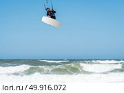 Kiteboarder enjoy surfing on a sunny day. Стоковое фото, агентство Ingram Publishing / Фотобанк Лори