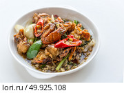 Fresh soft crabs cooked in black pepper sauce on white background. Стоковое фото, агентство Ingram Publishing / Фотобанк Лори