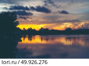 landscape sunset over the tropical lake in Thailand. Стоковое фото, агентство Ingram Publishing / Фотобанк Лори