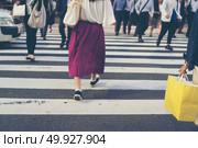 FUKUOKA, JAPAN-October 6, 2017: Many Tourists are walking pass the Torii gate of Dazaifu tenmangu shrine in the temple ,The most famous and ancient in Fukuoka, Japan. Редакционное фото, агентство Ingram Publishing / Фотобанк Лори