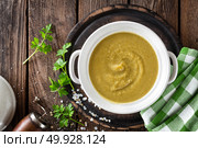 Vegetable cream soup, puree on wooden rustic table, top view. Стоковое фото, агентство Ingram Publishing / Фотобанк Лори