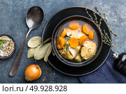 Delicious fresh fish soup with hake in bowl on table. Top view. Стоковое фото, агентство Ingram Publishing / Фотобанк Лори