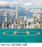 Hong Kong Skyline from Victoria Peak with helipad. Стоковое фото, агентство Ingram Publishing / Фотобанк Лори