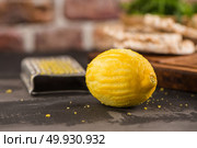 Lemon,  lemon zest and grater peel  on the wooden table. Стоковое фото, агентство Ingram Publishing / Фотобанк Лори