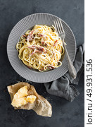 Carbonara pasta, spaghetti with pancetta, egg, hard parmesan cheese and cream sauce. Traditional italian cuisine. Pasta alla carbonara. Стоковое фото, агентство Ingram Publishing / Фотобанк Лори