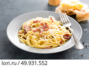 Carbonara pasta, spaghetti with pancetta, egg, hard parmesan cheese and cream sauce. Traditional italian cuisine. Pasta alla carbonara. Стоковое фото, агентство Ingram Publishing / Фотобанк Лори
