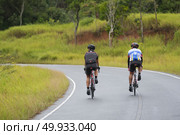 Nakornratchasima, Thailand - March 20, 2016: Activities of Mountain Bikers challenging themselves uphill on a Long Weekend Sporting and Fitness at Khao yai national park. Редакционное фото, агентство Ingram Publishing / Фотобанк Лори