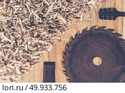 Carpenter tools on wooden table with sawdust. Carpenter workplac. Carpenter tools on wooden table with sawdust. Carpenter workplace top view. Carpenter tools on wooden table with sawdust. Carpenter workplace top view. Стоковое фото, агентство Ingram Publishing / Фотобанк Лори