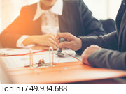 Business hand putting stamp on a document, close up. Стоковое фото, агентство Ingram Publishing / Фотобанк Лори