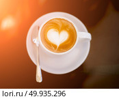 white cups of Cappuccino coffee with heart shaped milk foam. . Стоковое фото, агентство Ingram Publishing / Фотобанк Лори
