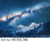 Milky Way and Beautiful Manaslu, Himalayas. Amazing view with himalayan mountains and starry sky at night in Nepal. High rocks with snowy peak and sky with stars. Night landscape with bright milky way. Milky Way and Beautiful Manaslu, Himalayas. Space. Стоковое фото, агентство Ingram Publishing / Фотобанк Лори