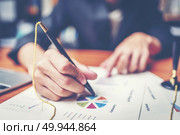 Business hands pointing and signing terms and agreement papers contract, signing concept. Стоковое фото, агентство Ingram Publishing / Фотобанк Лори